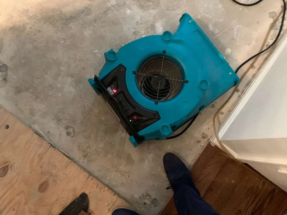 Air mover drying subfloor during Leak Detection & Repair in Ross
